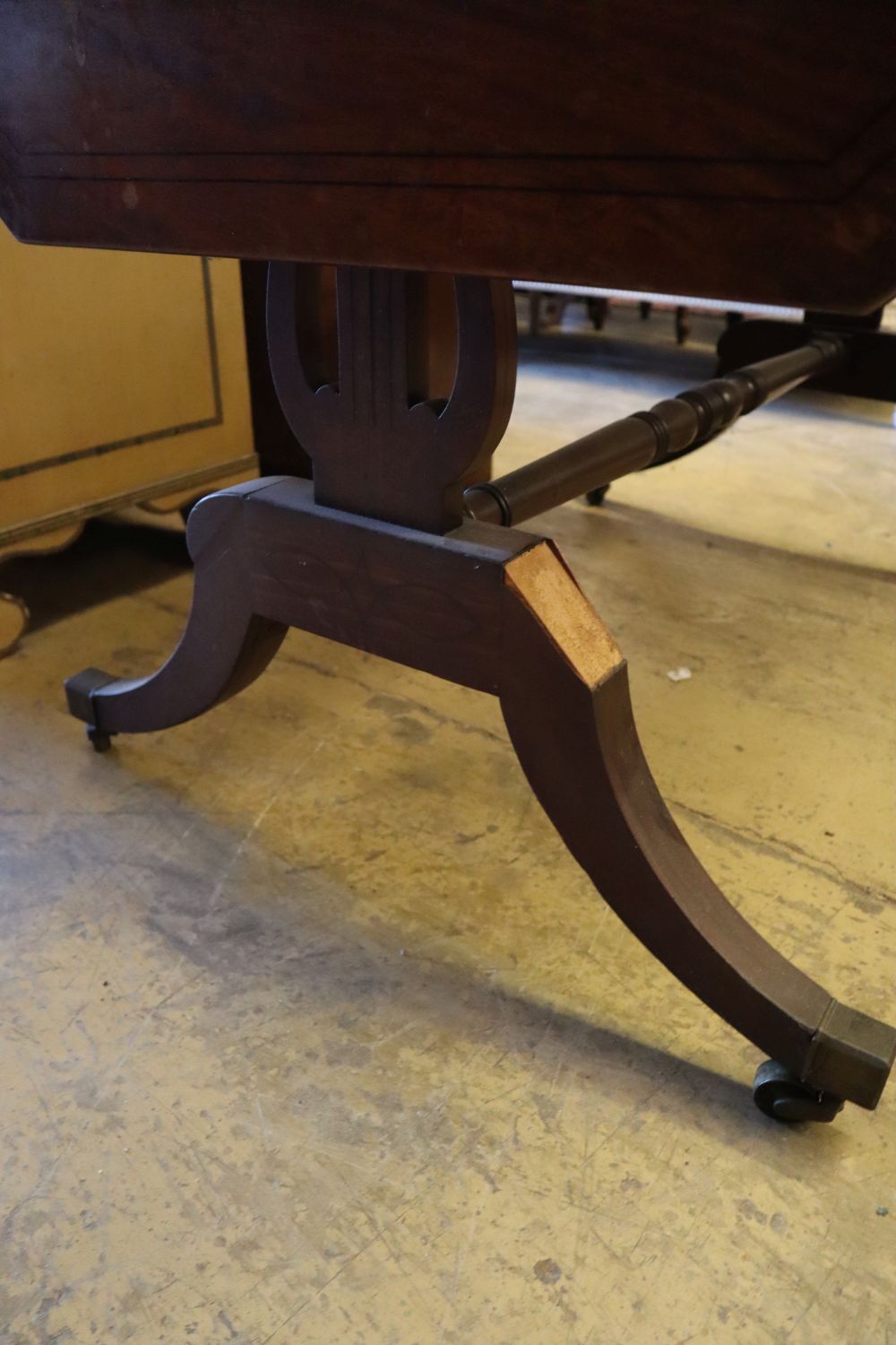 A Regency mahogany sofa table, with ebony stringing, and two frieze drawers, width 97cm